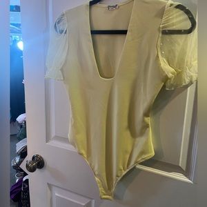 NWOT Free People yellow bodysuit sheer sleeves. Small